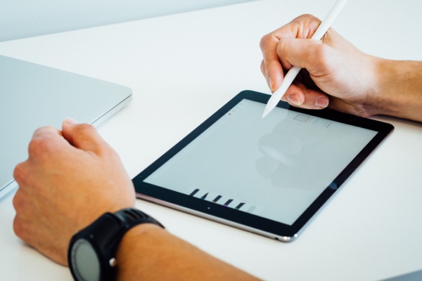 Small business owner reviewing financial reports with accountant in Manchester office